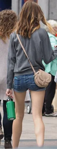 Smiling, slim and sexy in her shorts
