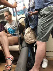 Tall Candid Teen Girl in Denim Shorts And Sandals Sitting in the Subway Train, Then Walking Down the Station