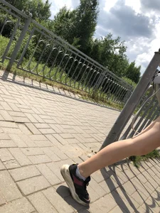 Cute Girl in Denim Shorts Walking Down a Railway Station Gallery