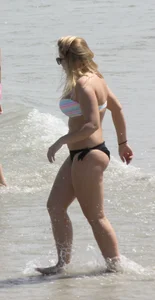 Big boobed thick blonde on the beach in a bikini