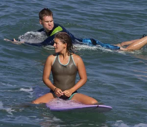 Candid surfer babes on the beach and in bikinis