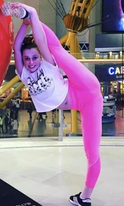 Young gymnast girl showing off her stretch