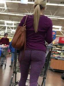 Sexy blonde shopping at Walmart in purple leggings with some vpl