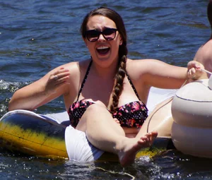 Sexy party girls in bikinis on a lake