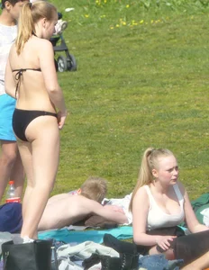 Teen taking off her dress in the park