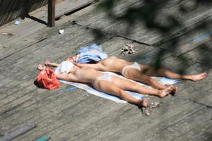 Two teens stripping and going topless to tan