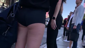Hottie in spandex booty shorts with a nice ass showing her cheeks and slight camel toe