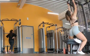 Gym brunette in tight grey shorts