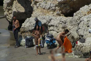 Girls on a nude beach in Sitges, Spain