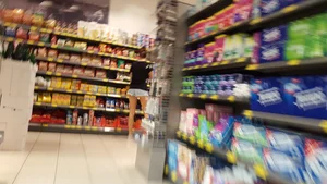 Girl shopping in short denim shorts showing some cheek