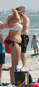 Big boobed thick blonde on the beach in a bikini