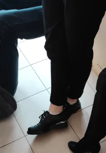 College Teen's Legs in Black Pants And Shoes, Flashing Ankles