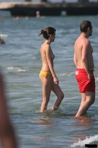 A bunch of sexy beach voyeur babes in bikinis, thongs and topless