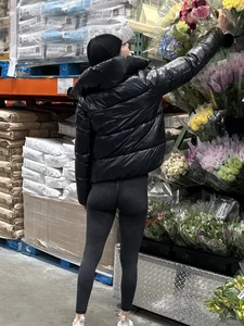 Girl in leggings with a perfect ass and slim legs picking flowers at the supermarket creepshots