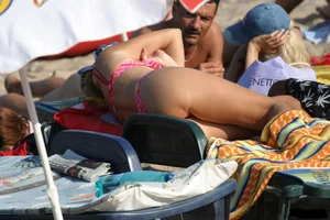 Beach voyeur girls in bikinis, thongs and topless