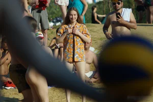 Cute Girl with Thin Legs in a Shirt on top of Swimsuit on the Beach Candid Pics