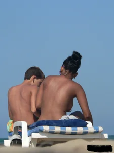 Hot ass topless beach girl with great tits lets her little brother oil up her ass in thong bikini