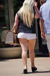 Thick blonde with big boobs in short white shorts