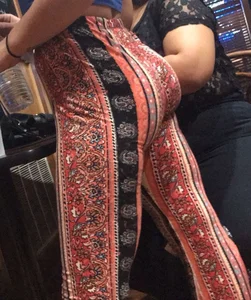 Big fat ass in pattern flare pants with some pokey pierced nipples in a blue crop top