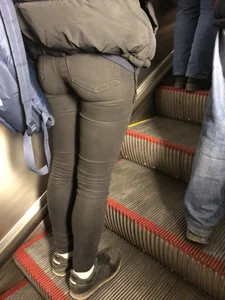 Booty in Tight Black Jeans on the Escalator Closeup Candid Photo