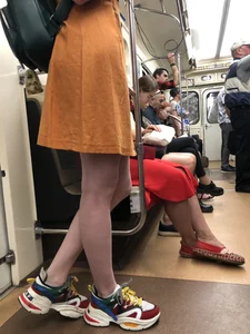 Cute Teen Girl in a Dress With Slim Legs Standing in the Subway Train, Then Crossing the Street Photo Gallery