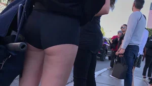 Hottie in spandex booty shorts with a nice ass showing her cheeks and slight camel toe