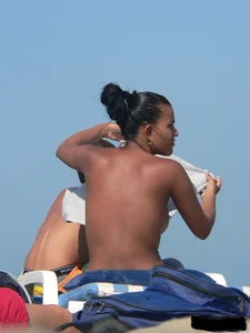 Hot ass topless beach girl with great tits lets her little brother oil up her ass in thong bikini