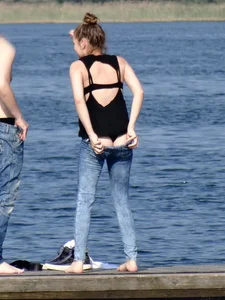 Girl on the water in black thong bikini with a nice ass