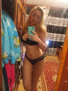 Cute Girl With Wavy Hair Mirror Selfies in Underwear