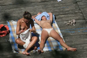 Two teens stripping and going topless to tan