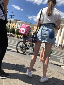 Teen Candid Girl in a Denim Skirt And Sneakers With Thin Legs on a Crosswalk Creepshots