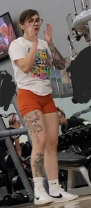 Tattooed PAWG showing cakes in tight shorts