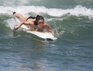 Candid surfer babes on the beach and in bikinis
