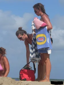 Sexy beach lady in tiny brown thong bikini with a nice ass