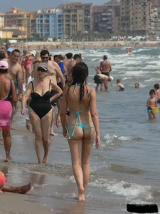 Bunch of sexy babes at the beach in thong bikinis