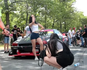Girls Taking Photos at the Racing Event Candids
