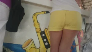 Milf in yellow shorts with vpl and a wedgie