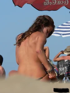 2 topless thonged sexy friends on the beach with great bodies