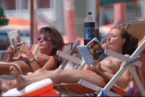 Girls on a nude beach in Bibione, Italy