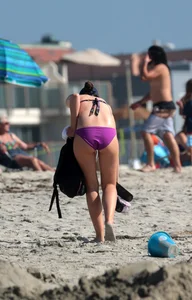 Beach babe in purple bikini with nice mound, booty and slight camel toe