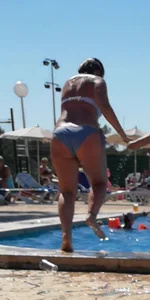Sexy British girl in a bikini at the pool with camel toe