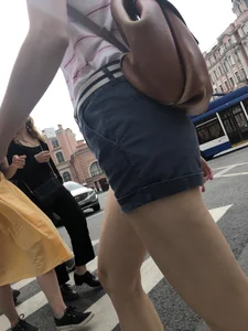 Young Girl in Shorts And Sandals Crossing the Street Gallery