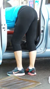 Girl in tight see through leggings with nice ass cleaning her car