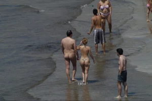Girls on a nude beach in Sitges, Spain