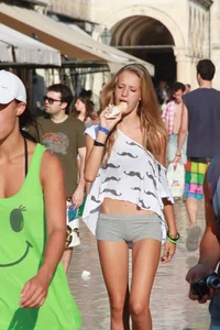 Sexy skinny blonde eating ice cream in short tight grey shorts