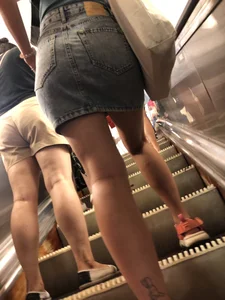 Candid ass in a short denim skirt, girl spreading her legs on the escalator creepshot