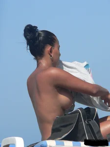 Hot ass topless beach girl with great tits lets her little brother oil up her ass in thong bikini