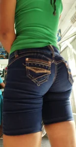 Big booty Latina in tight long denim shorts