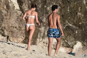 Iris Mittenaere in a white thong bikini on the beach in St Martin
