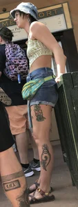 Tatted up hippie in short jean shorts with a nip slip